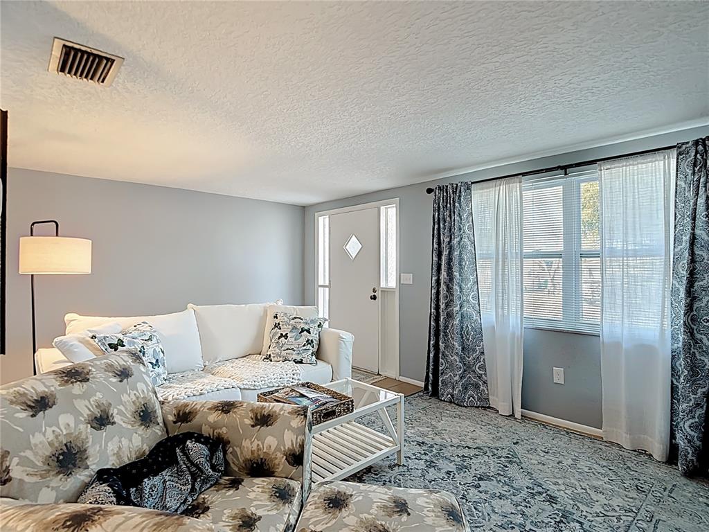 9420 Cochise Lane Port Richey, FL 34668 - Photo 10 of 47 a living room with furniture and a window