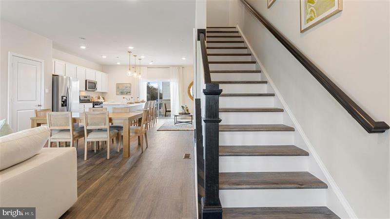 592 Swamp Creek Road Boyertown, PA 19512 - Photo 13 of 26 a view of a dining room with furniture entryway and wooden floor