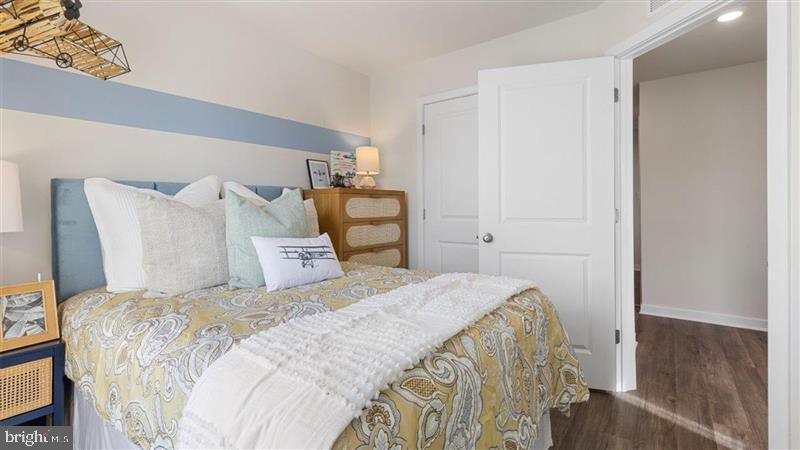 592 Swamp Creek Road Boyertown, PA 19512 - Photo 23 of 26 a bedroom with a bed and wooden floor