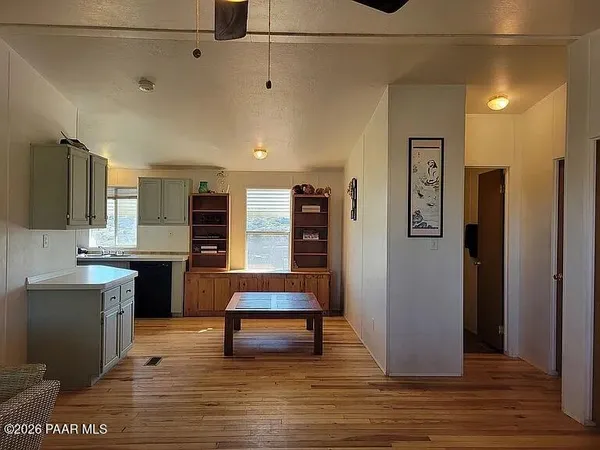 a kitchen with a sink a refrigerator a stove and a cabinets