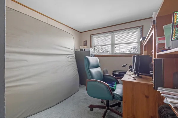 a workspace with furniture and a window