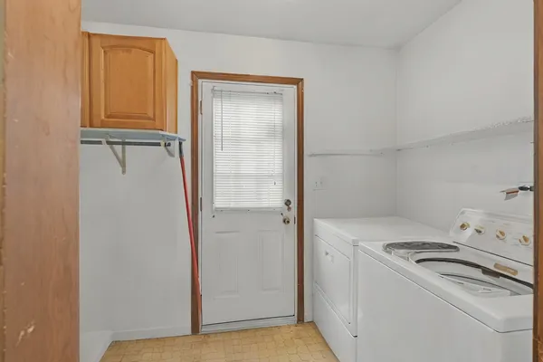 a view of storage and utility room with washer and dryer