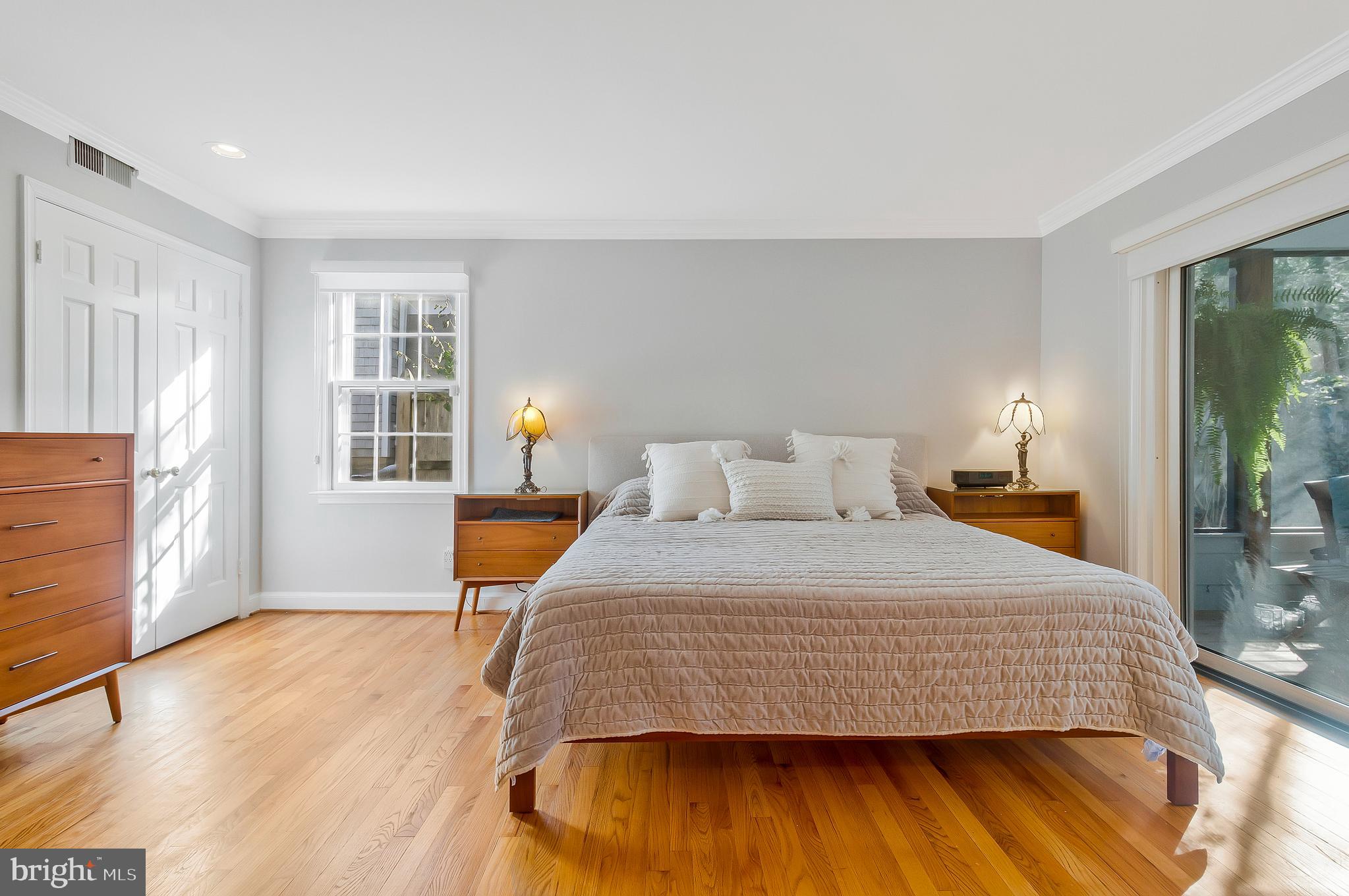 2812 Greenvale Street Chevy Chase, MD 20815 - Photo 17 of 27 a bedroom with a bed and wooden floor
