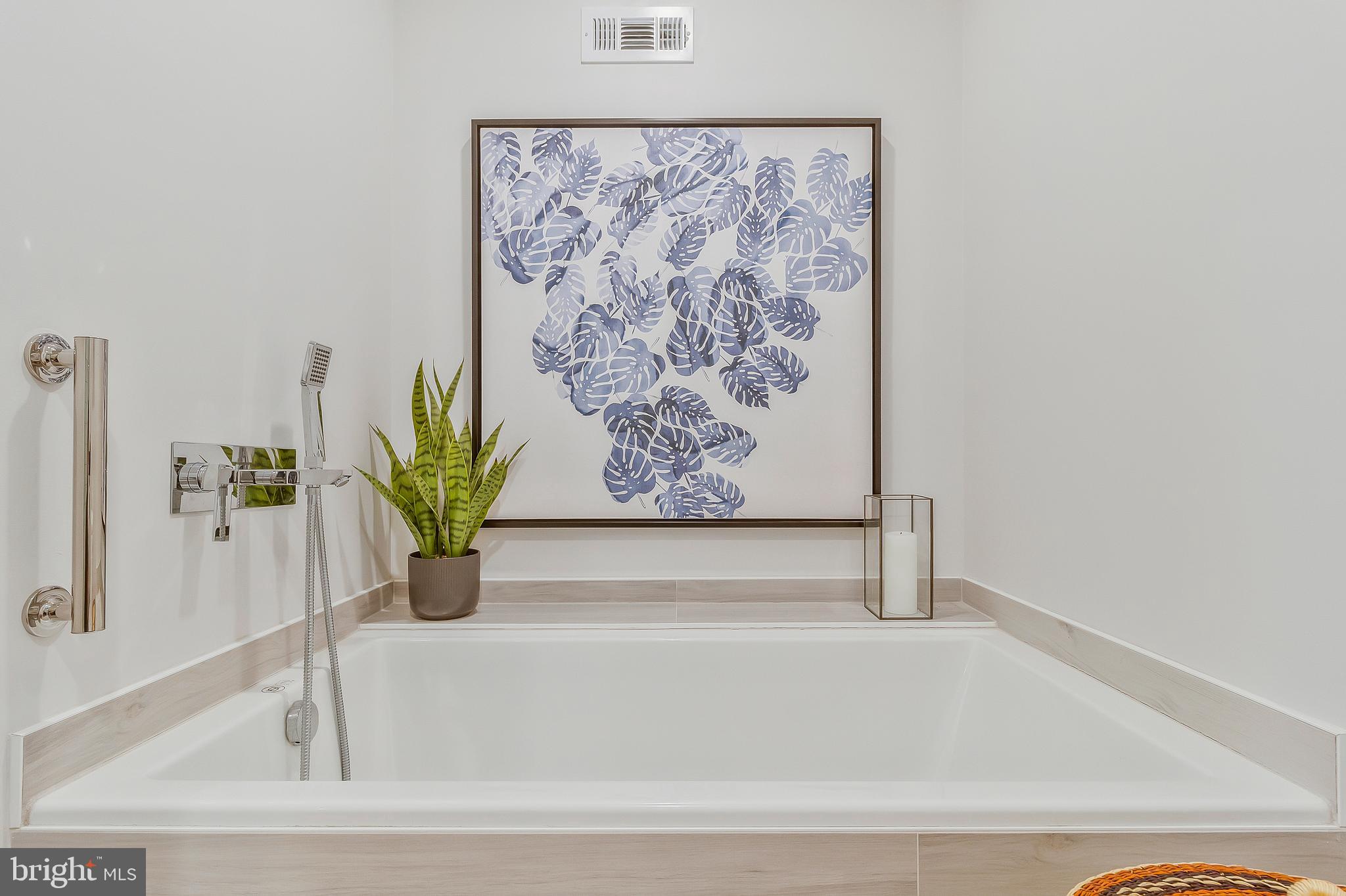 2812 Greenvale Street Chevy Chase, MD 20815 - Photo 20 of 27 a white bath tub with a shower