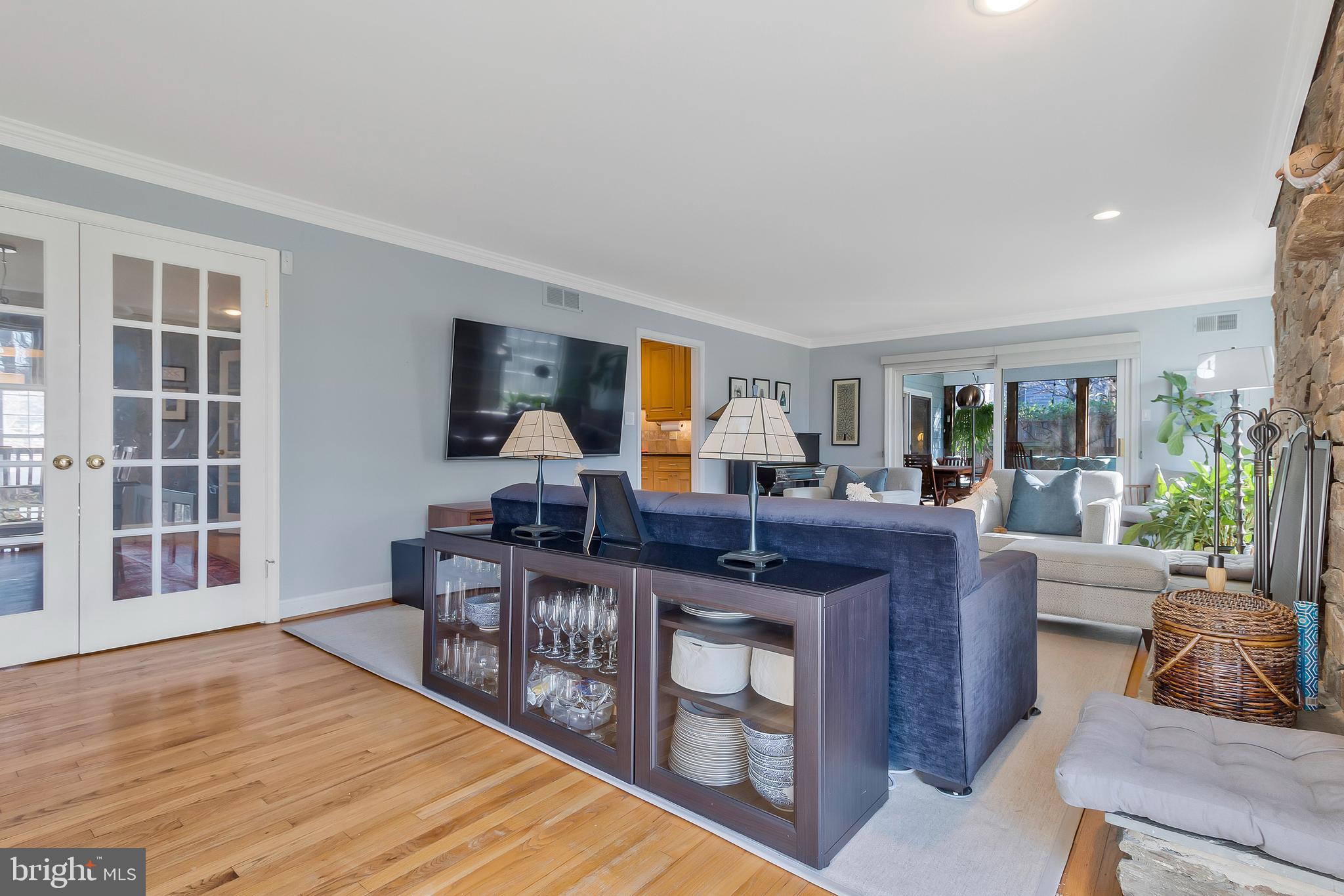 2812 Greenvale Street Chevy Chase, MD 20815 - Photo 5 of 27 a living room with furniture a flat screen tv and a table