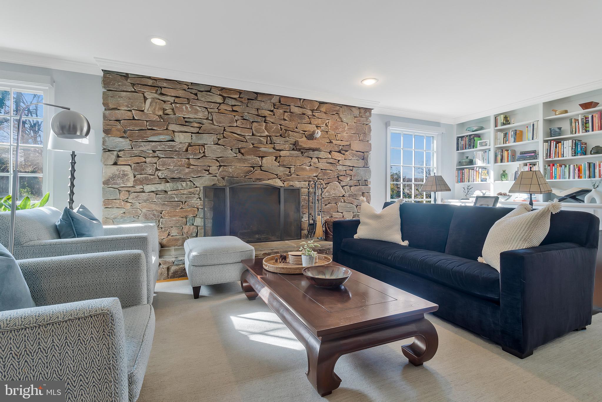 2812 Greenvale Street Chevy Chase, MD 20815 - Photo 6 of 27 a living room with furniture and a fireplace