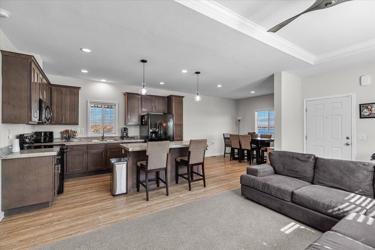 4399 Aplicella Court, Unit 75 Manteca, CA 95337 - Photo 12 of 30 a living room kitchen with stainless steel appliances granite countertop a living room dining room and kitchen view