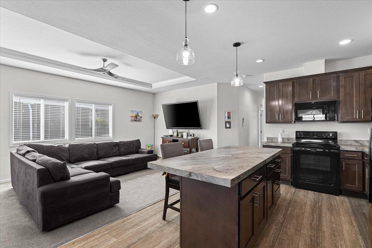 4399 Aplicella Court, Unit 75 Manteca, CA 95337 - Photo 17 of 30 a living room with furniture and a flat screen tv