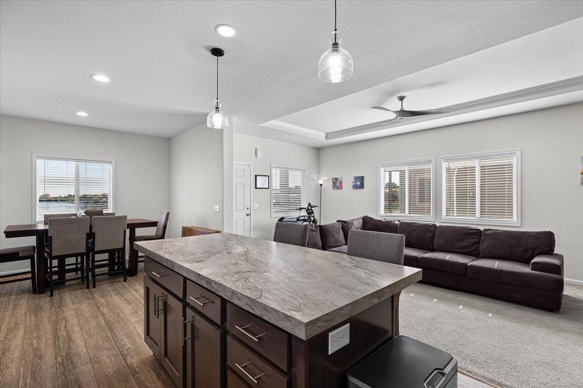 4399 Aplicella Court, Unit 75 Manteca, CA 95337 - Photo 18 of 30 a view of a dining room with furniture and wooden floor