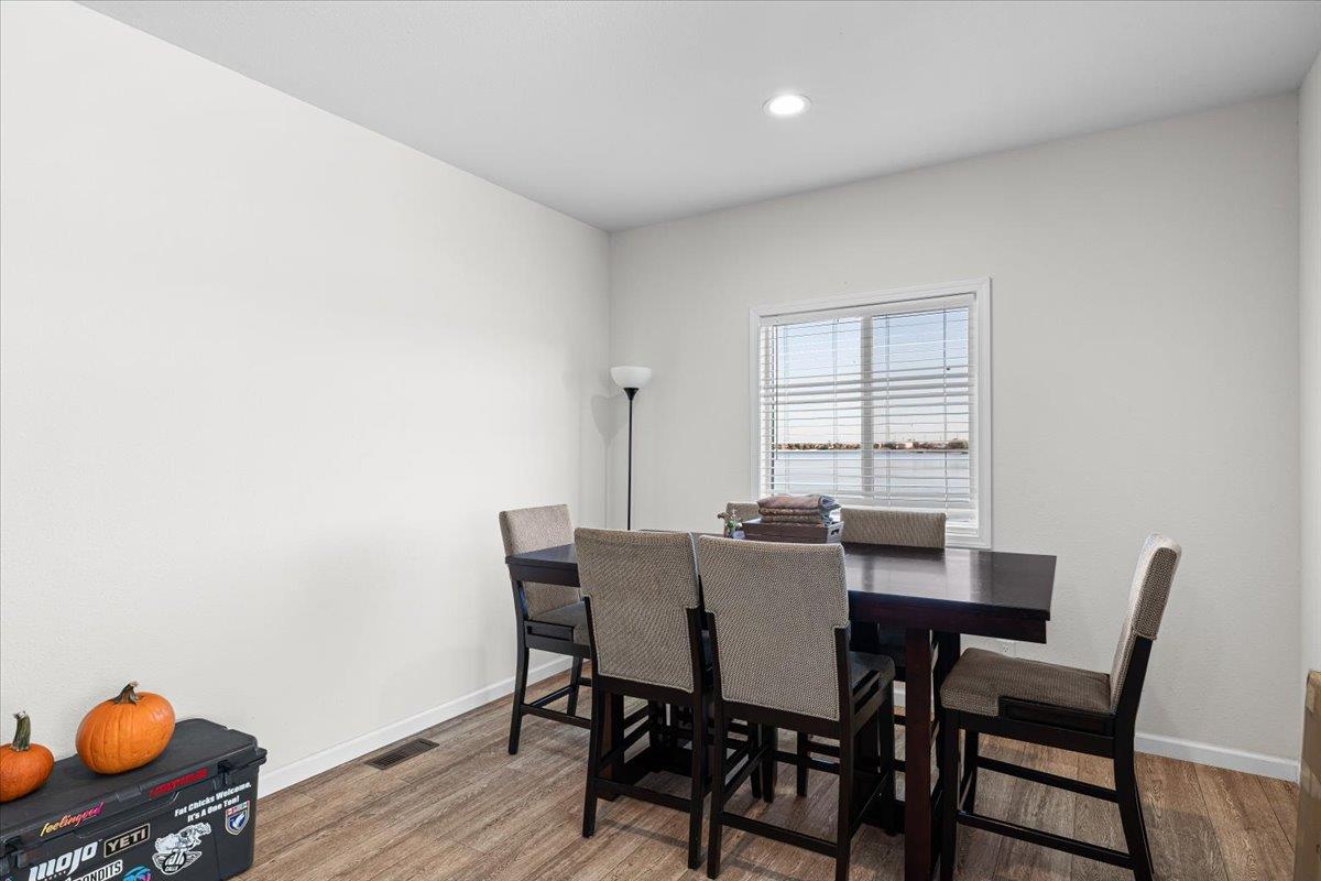 4399 Aplicella Court, Unit 75 Manteca, CA 95337 - Photo 19 of 30 a view of a dining room with furniture and wooden floor