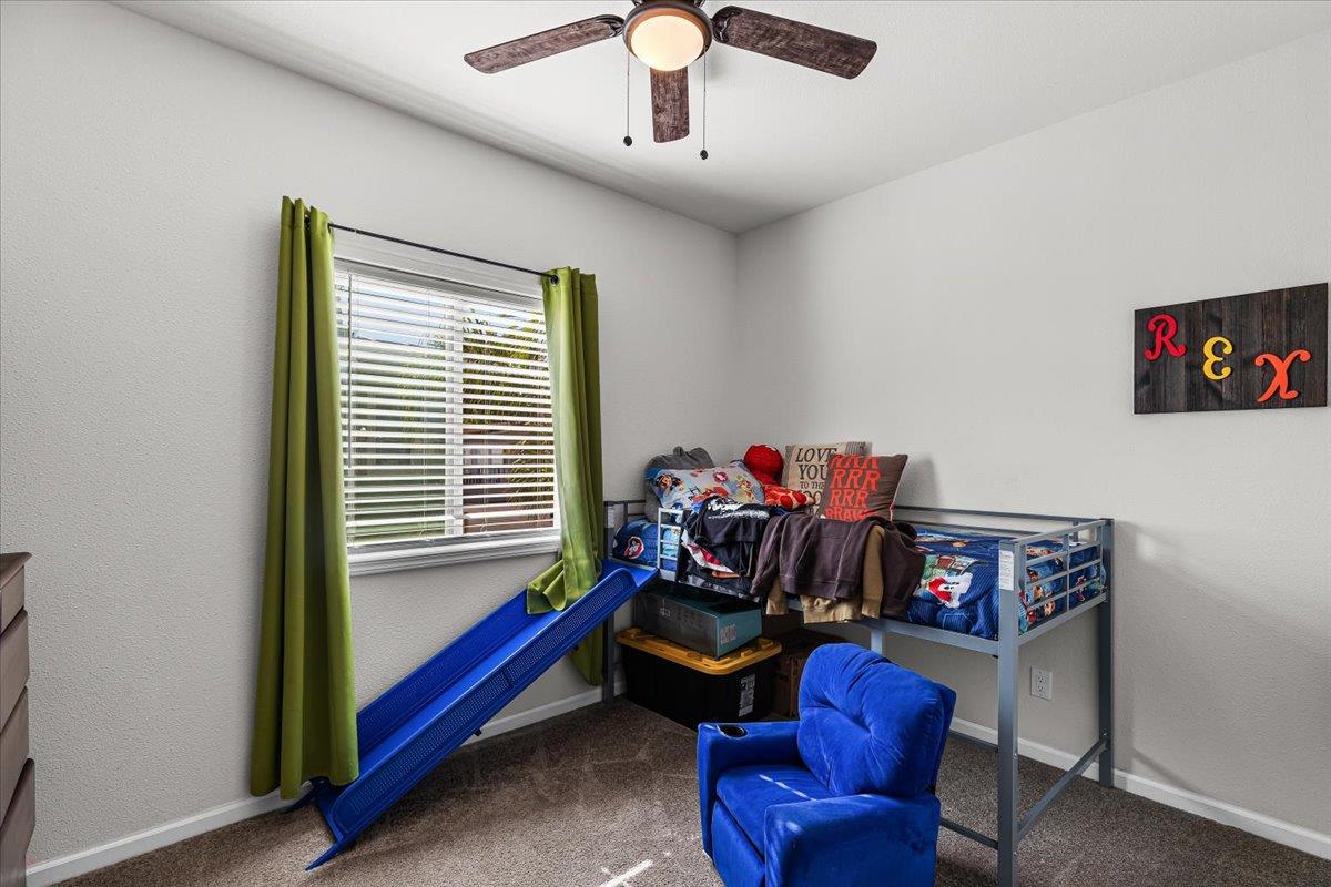 4399 Aplicella Court, Unit 75 Manteca, CA 95337 - Photo 22 of 30 a bedroom with furniture and a window