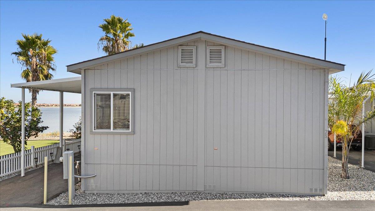4399 Aplicella Court, Unit 75 Manteca, CA 95337 - Photo 27 of 30 a front view of a house with a yard