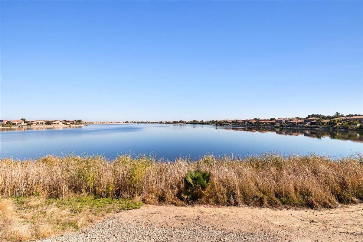4399 Aplicella Court, Unit 75 Manteca, CA 95337 - Photo 29 of 30 a view of lake with green space