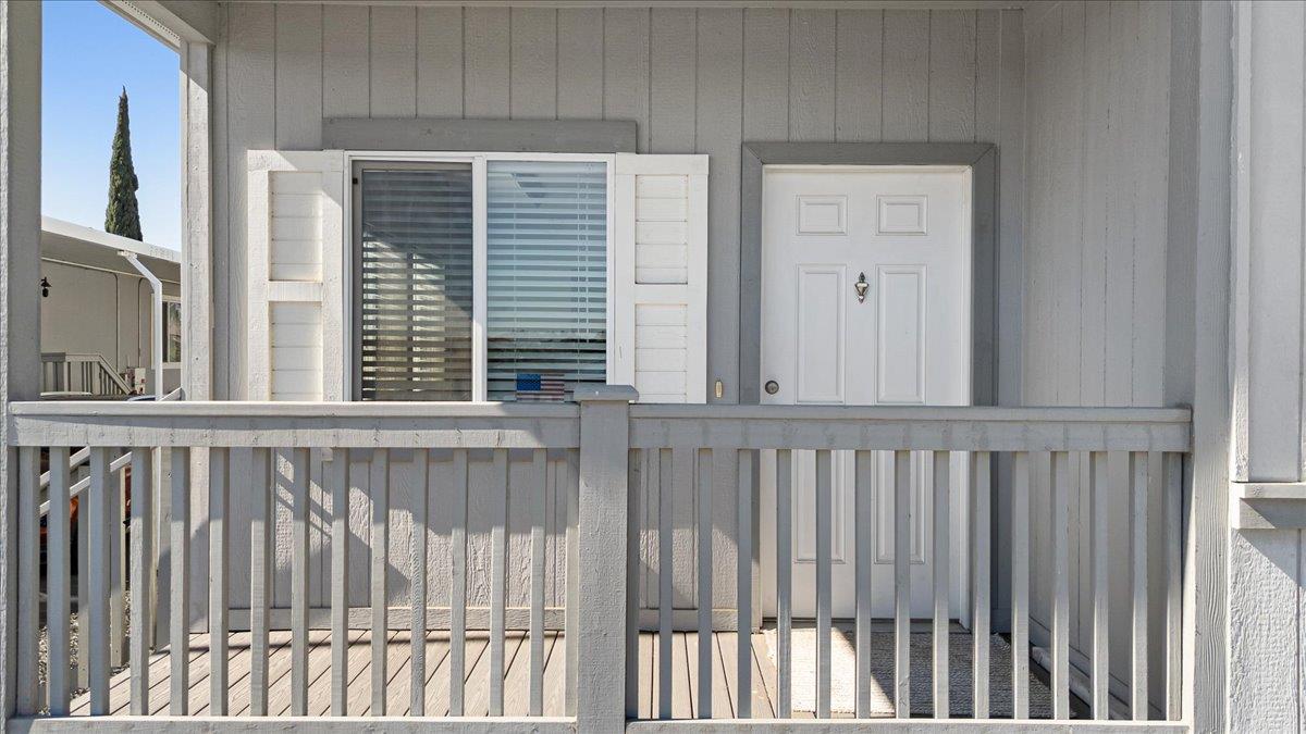 4399 Aplicella Court, Unit 75 Manteca, CA 95337 - Photo 7 of 30 a view of a porch with wooden floor
