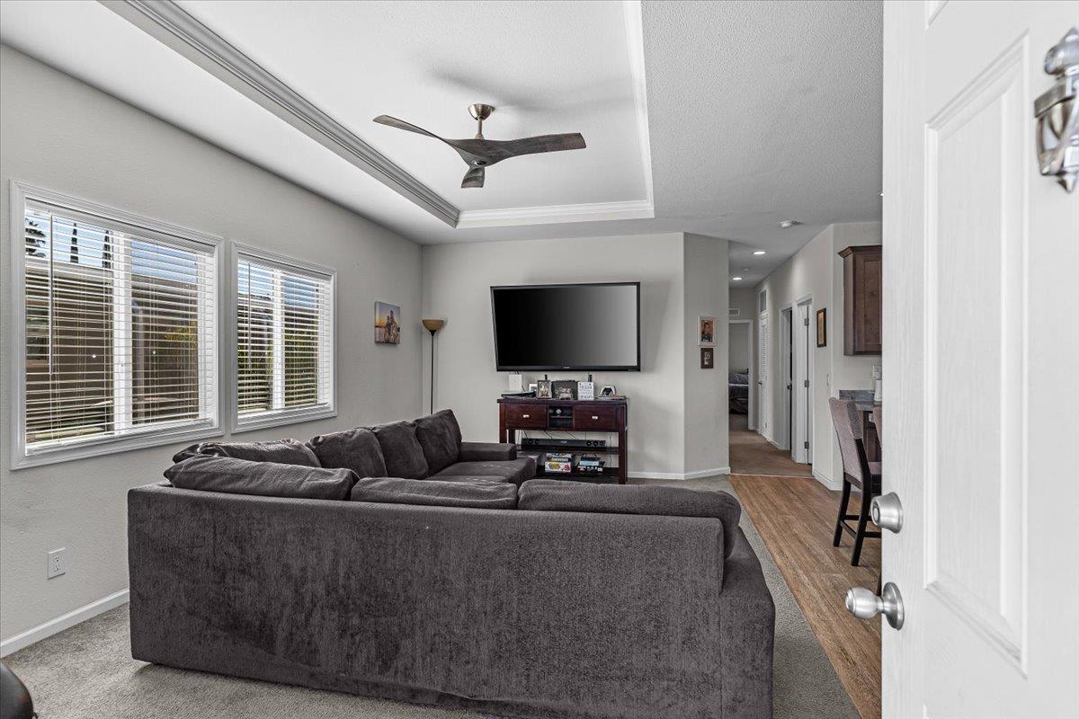 4399 Aplicella Court, Unit 75 Manteca, CA 95337 - Photo 8 of 30 a living room with furniture and a flat screen tv