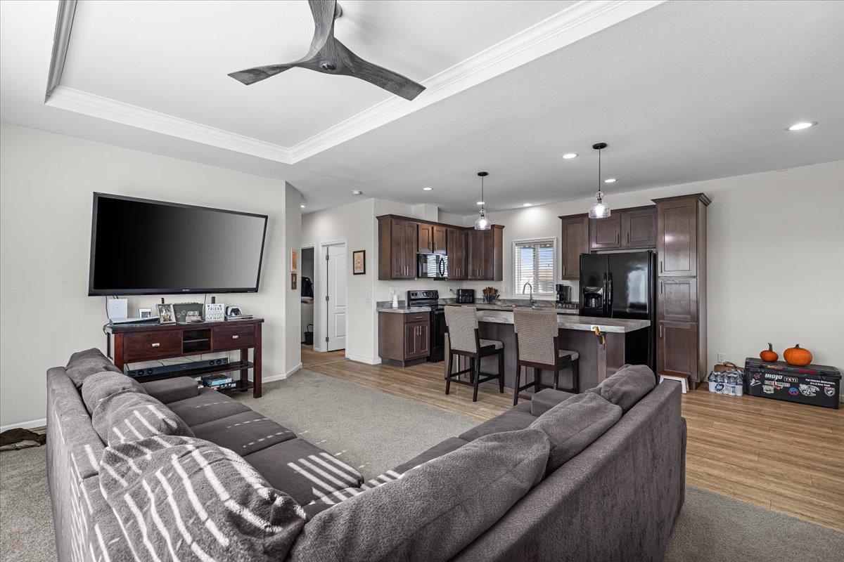 4399 Aplicella Court, Unit 75 Manteca, CA 95337 - Photo 9 of 30 a living room with furniture and a flat screen tv