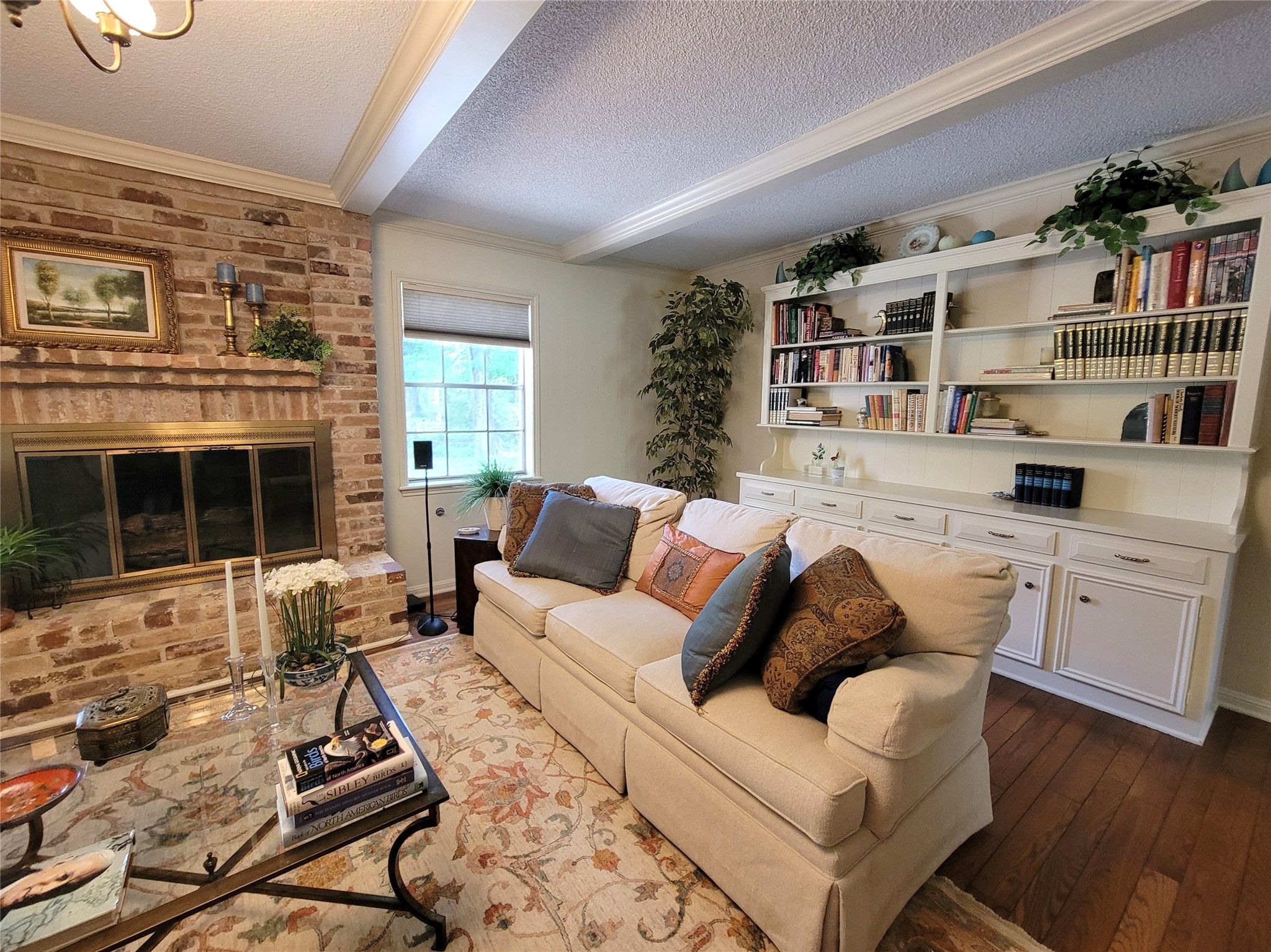 456 Lexington Court Conroe, TX 77302 - Photo 15 of 33 a living room with furniture and a fireplace