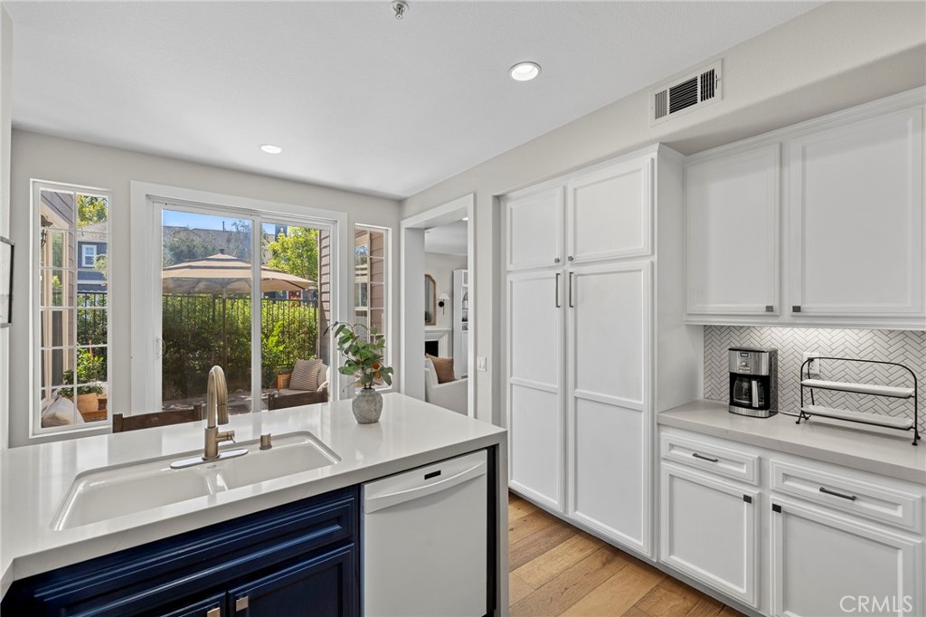 36 Tuberose Street Ladera Ranch, CA 92694 - Photo 12 of 39 a kitchen with a refrigerator and sink