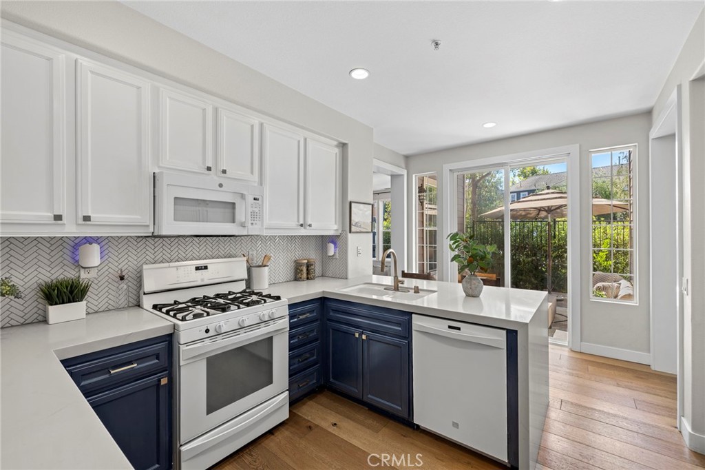 36 Tuberose Street Ladera Ranch, CA 92694 - Photo 14 of 39 a kitchen with a sink stove and cabinets