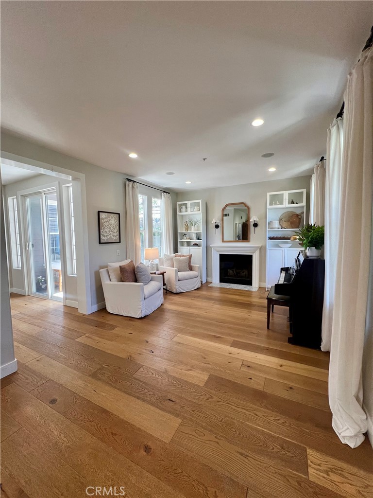 36 Tuberose Street Ladera Ranch, CA 92694 - Photo 2 of 39 a living room with furniture and a fireplace