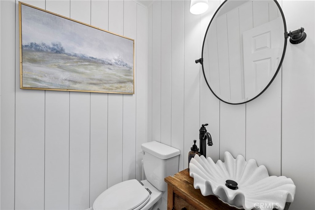 36 Tuberose Street Ladera Ranch, CA 92694 - Photo 21 of 39 a bathroom with a toilet and a mirror