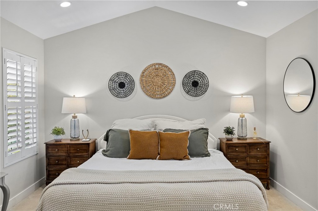 36 Tuberose Street Ladera Ranch, CA 92694 - Photo 27 of 39 a bedroom with a bed and a lamp on dresser