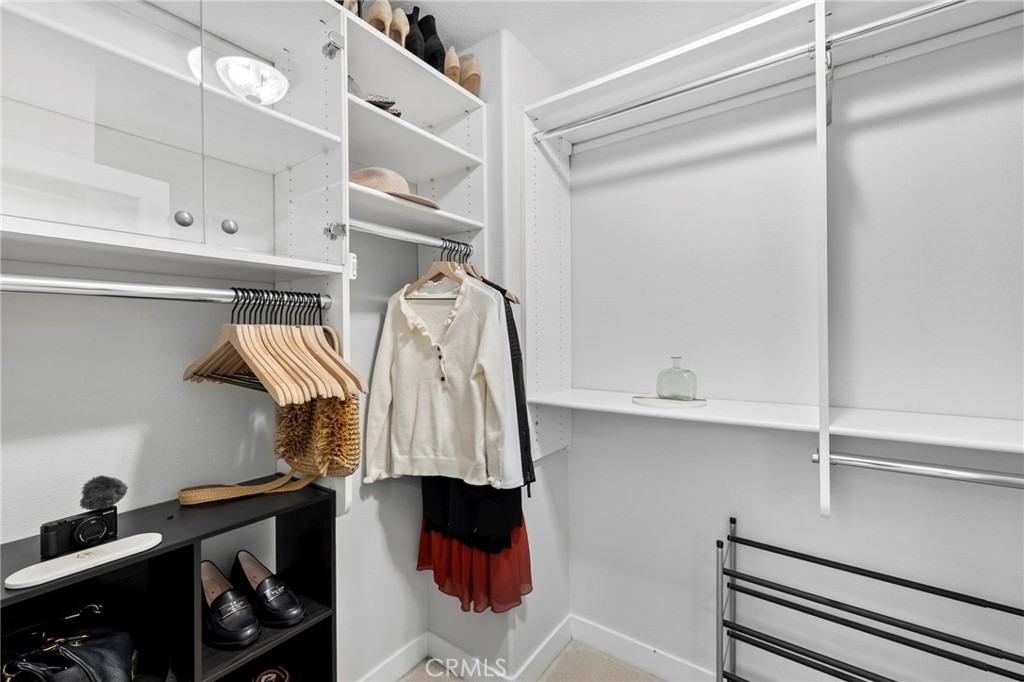 36 Tuberose Street Ladera Ranch, CA 92694 - Photo 31 of 39 a view of walk in closet with clothes and shoes