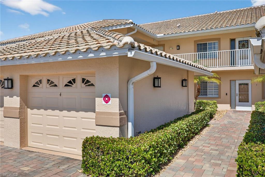 9009 Michael Circle, Unit 4 Naples, FL 34113 - Photo 1 of 34 a front view of a house