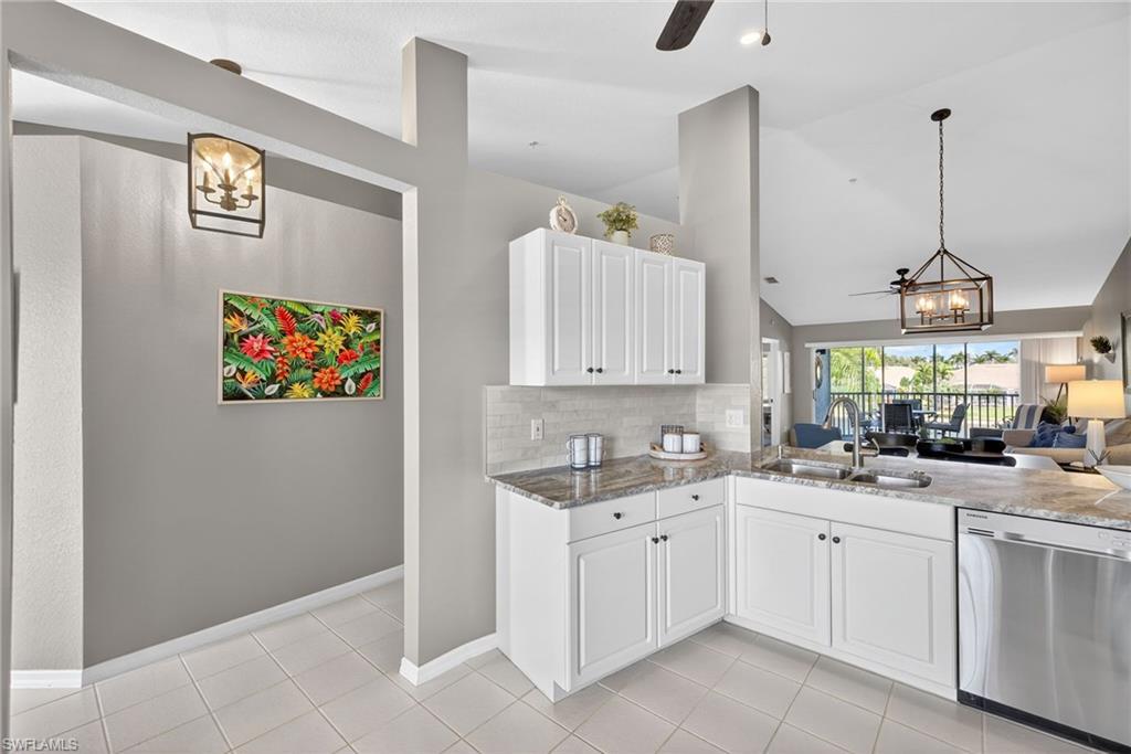 9009 Michael Circle, Unit 4 Naples, FL 34113 - Photo 34 of 34 a view of a kitchen with cabinets