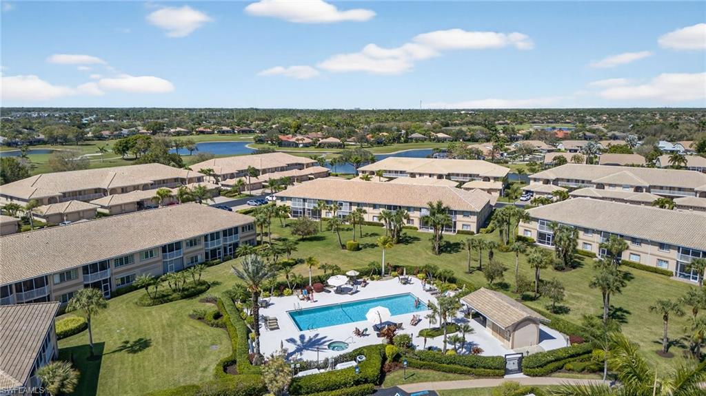 9009 Michael Circle, Unit 4 Naples, FL 34113 - Photo 26 of 34 an aerial view of multiple house