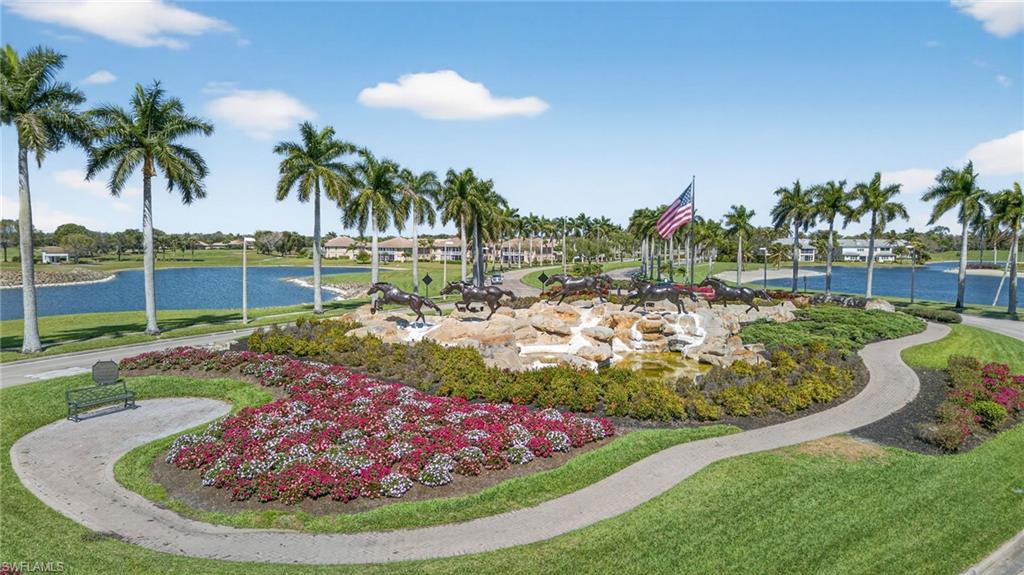 9009 Michael Circle, Unit 4 Naples, FL 34113 - Photo 27 of 34 a view of a yard with palm trees