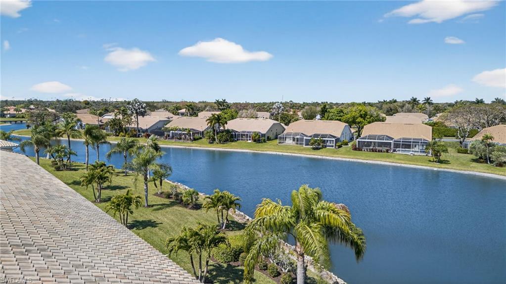 9009 Michael Circle, Unit 4 Naples, FL 34113 - Photo 32 of 34 a view of a lake with a city
