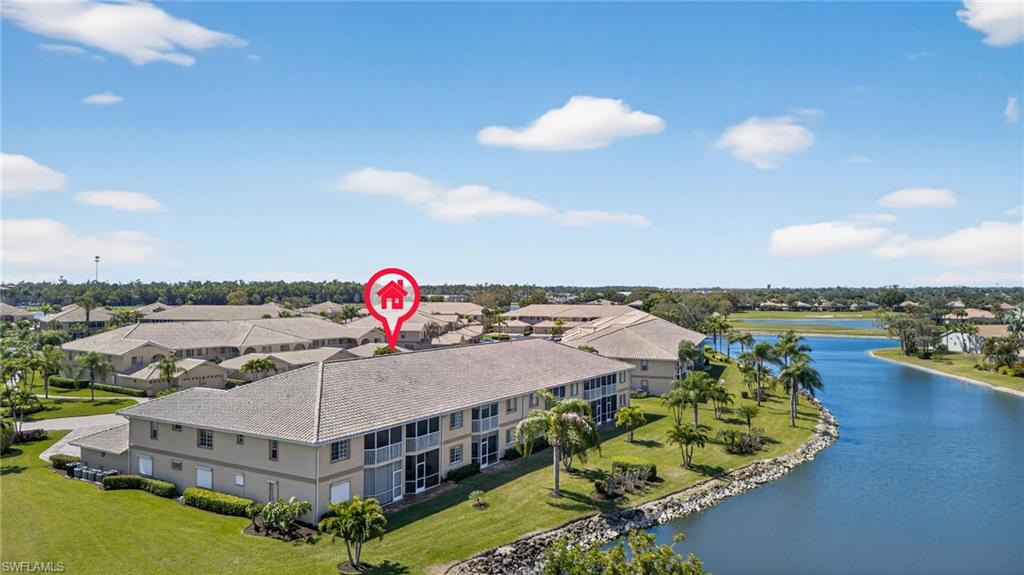 9009 Michael Circle, Unit 4 Naples, FL 34113 - Photo 33 of 34 a view of a house with outdoor space and pool