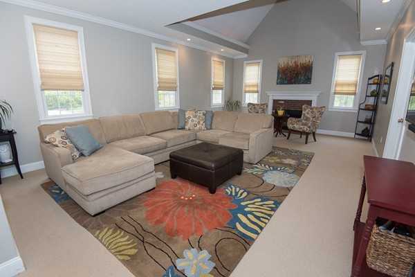 85 Johnson Drive Holliston, MA 01746 - Photo 12 of 30 a living room with furniture and a flat screen tv