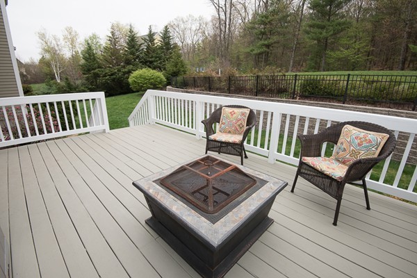 85 Johnson Drive Holliston, MA 01746 - Photo 29 of 30 a view of a wooden deck with furniture