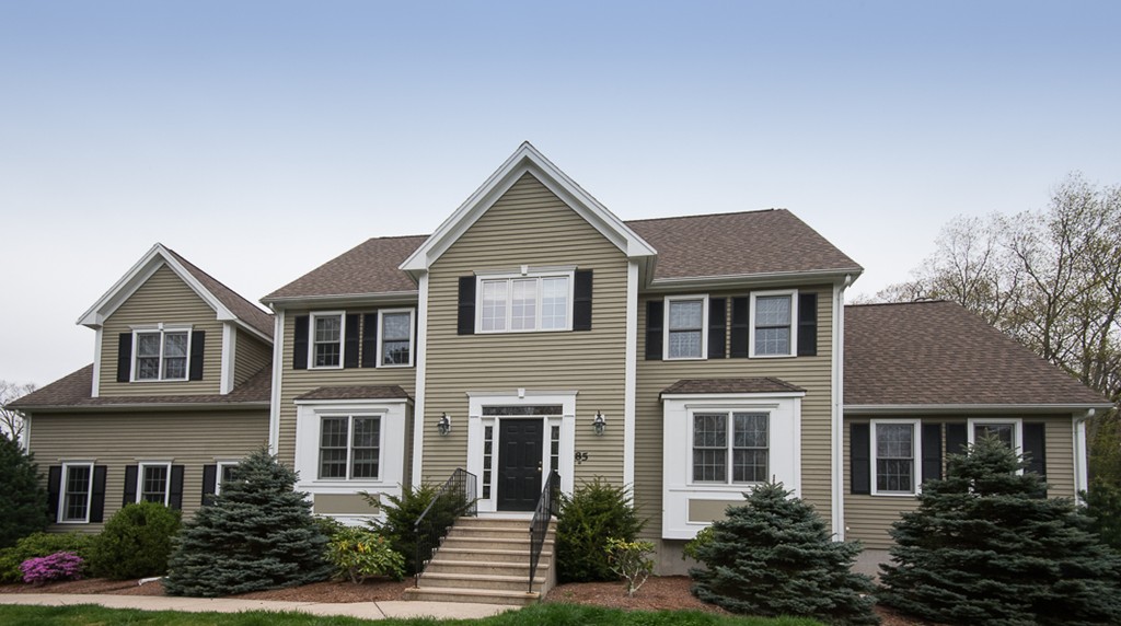 85 Johnson Drive Holliston, MA 01746 - Photo 30 of 30 a front view of a house with a garden
