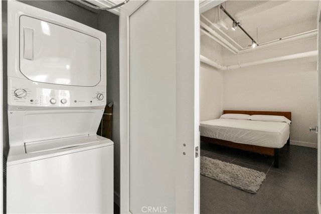 a bathroom with a toilet and a mirror