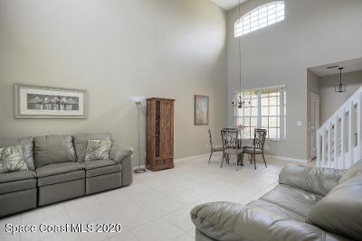 304 Intrepid Way Melbourne, FL 32903 - Photo 14 of 37 a living room with furniture and a table