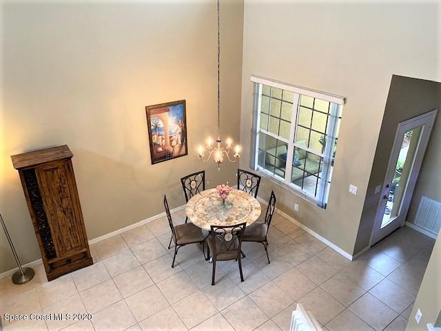 304 Intrepid Way Melbourne, FL 32903 - Photo 3 of 37 a view of a room with furniture and a window