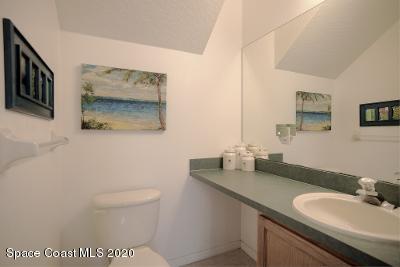 304 Intrepid Way Melbourne, FL 32903 - Photo 23 of 37 a bathroom with a toilet sink and mirror