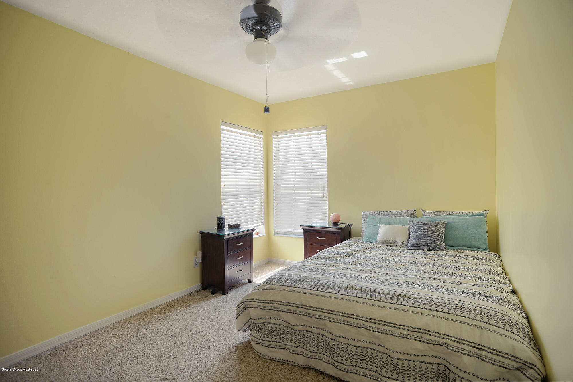 304 Intrepid Way Melbourne, FL 32903 - Photo 24 of 37 a bedroom with a bed and a painting on the wall