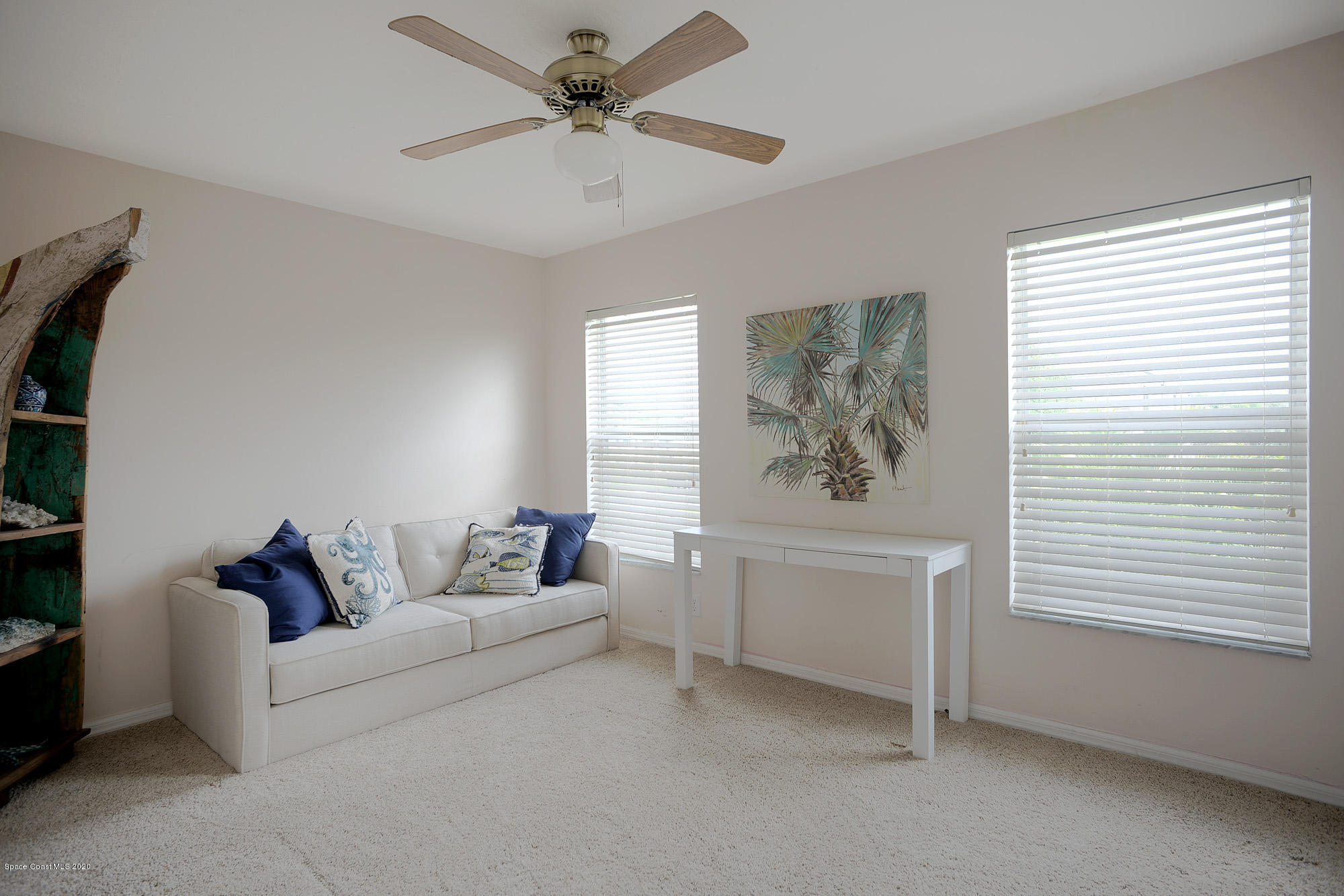 304 Intrepid Way Melbourne, FL 32903 - Photo 28 of 37 a living room with furniture and a large window