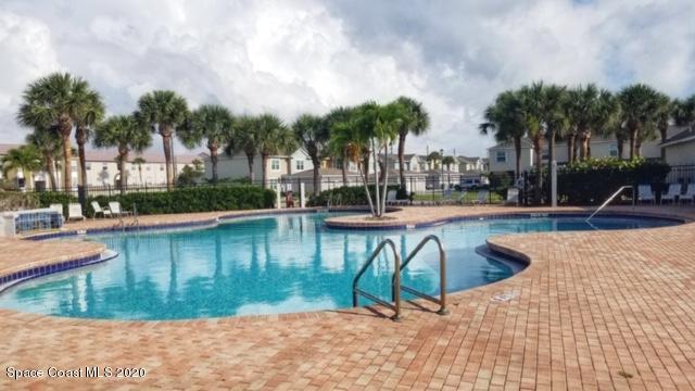 304 Intrepid Way Melbourne, FL 32903 - Photo 35 of 37 an outdoor space with swimming pool and lounge chair