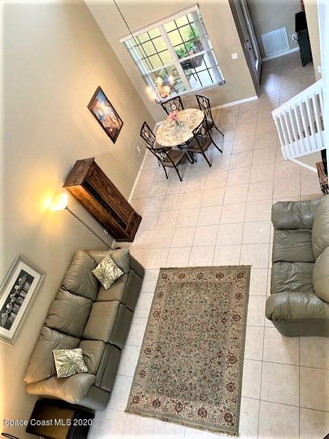 304 Intrepid Way Melbourne, FL 32903 - Photo 8 of 37 a living room with furniture and wooden floor