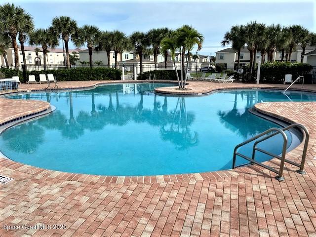 304 Intrepid Way Melbourne, FL 32903 - Photo 9 of 37 a view of a swimming pool with lounge chair