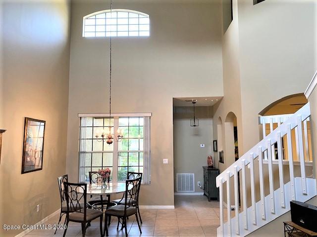 304 Intrepid Way Melbourne, FL 32903 - Photo 10 of 37 a view of a dining room with furniture and a window