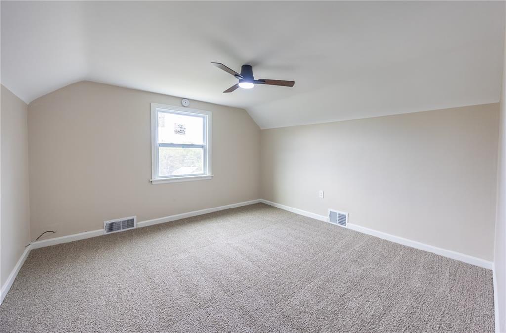 552 Stephens Street Ambridge, PA 15003 - Photo 15 of 21 an empty room with a window and ceiling fan