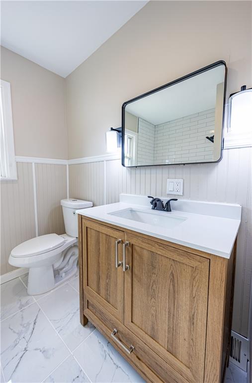 552 Stephens Street Ambridge, PA 15003 - Photo 17 of 21 a bathroom with a sink a toilet and mirror