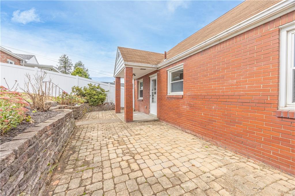 552 Stephens Street Ambridge, PA 15003 - Photo 19 of 21 a view of a grey house with a yard