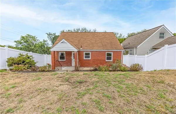 front view of a house with a dry yard